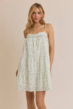 Woman wearing a floral dress against a beige background
