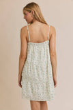 Woman wearing a floral dress against a beige background